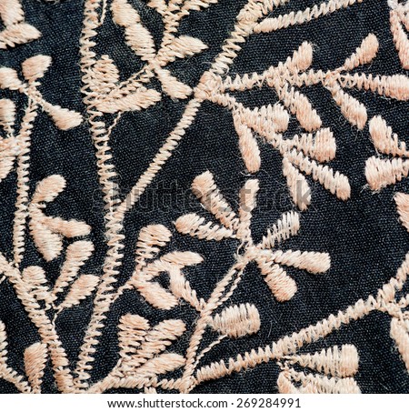 Texture of woven branches and leaves on a piece of black matter. The veil in the traditional style of India