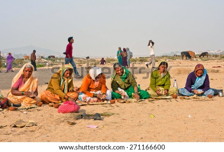 BIHAR, INDIA - JAN 9: Elderly women prepare prasadam to a religious ceremony in a deserted village on Januari 9 2013 in Gaya, India. Bihar with total population 82 million people has 62,8% of literacy