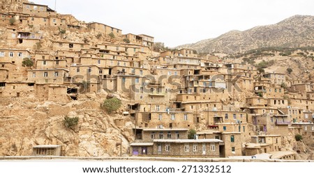 KURDISTAN, IRAN - OCT 11: Rural landscape with clay and brick houses in mountain village Palangan on October 11, 2014. Islamic Republic of Iran is the world\'s 17th most populous nation