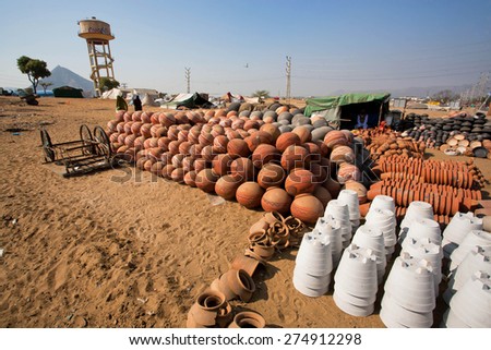 PUSHKAR, INDIA - FEB 10: Pots for sale in desert village of indian craftsmen on Fabruary 10, 2015 in Rajasthan. With population of 15,000, Pushkar is a popular touristic town in Ajmer district