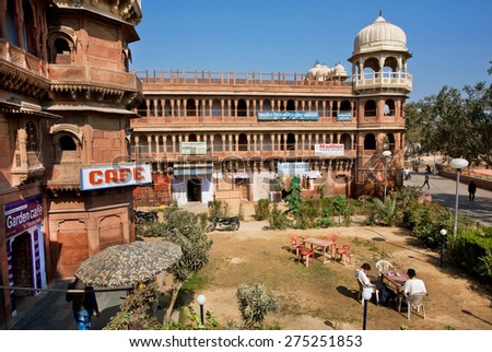 BIKANER, INDIA - MAR 4: People have breakfast in outdoor cafe in the historical building of hindu temple on March 4, 2015 in Rajasthan. Bikaner was founded by maharaja Rao Bika in 1486.
