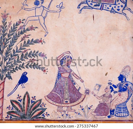 BIKANER, INDIA - MAR 4: Girl plays in a yo-yo, a fresco on the wall of the old house on March 4, 2015. Bikaner has population near 650,000. It was founded by maharaja Rao Bika in 1486