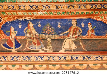 MANDAWA, INDIA - FEB 7: Rich indian couple and servants on rustic fresco in Shekhawati art style on February 7, 2015. With popul. of 21000, Mandawa is a touristic site with naive art Haveli mansions