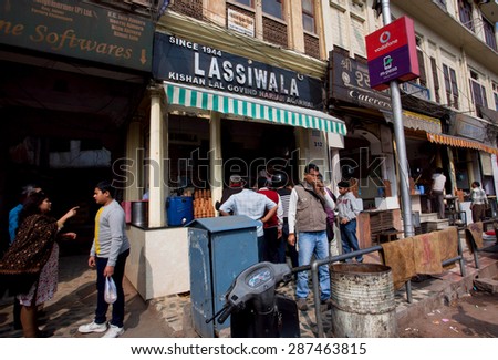 JAIPUR, INDIA - JAN 25: People drinking traditional indian milkshake Lassi in outdoor cafe Lassiwala on January 25, 2015. Jaipur, with population 6,664,000 people, is a capital of Rajasthan