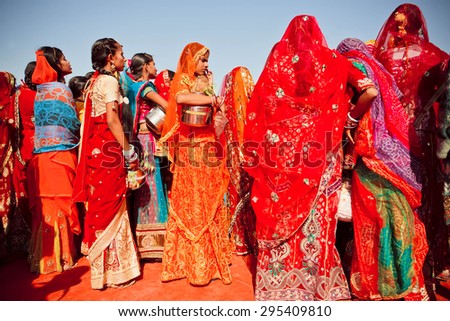 JAISALMER, INDIA - FEB 1: Many young attractive women staying with girlfriends in crowd of the popular Desert Festival on February 1, 2015. Every winter Jaisalmer takes Desert Festival of Rajasthan