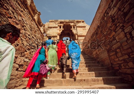 CHITTORGARH, INDIA - FEB 15: Crowd of women and children walking up the stairs to the temple on February 15, 2015. Chitaurgarh has population about 117,000 and the largest fort in Rajasthan