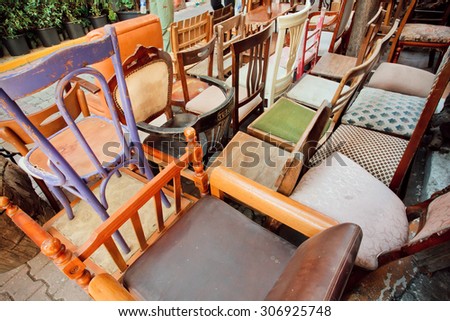 Antique market in Istanbul with wooden furniture and different chairs from Ottoman times