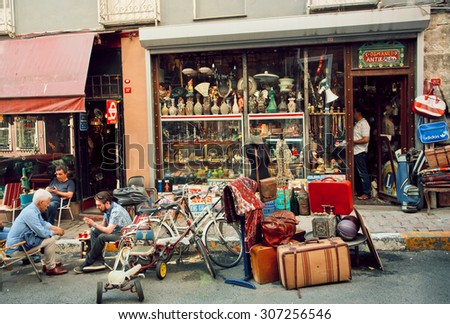 ISTANBUL - 23 JULY: Antique market and people drinking tea near vintage furniture store on July 23, 2015 in Cukurcuma district. Istanbul is the world\'s fifth-most-popular tourist destination