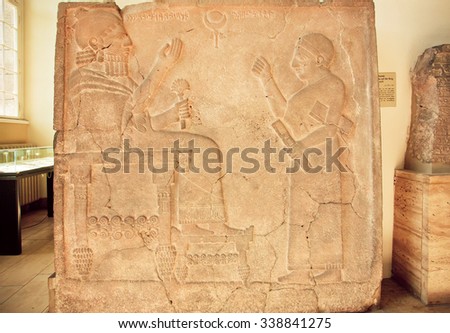 BERLIN, GERMANY - SEP 2, 2015: Hittite art, relief with King Bar-Rakib sitting on throne on Septemper 2, 2015. Made in 750 BC, sculptures found in South of Turkey, now in artifacts in Pergamon Museum