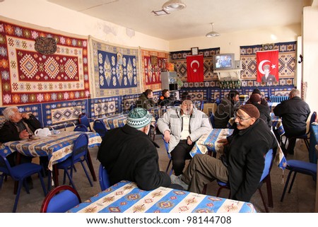 GOREME, TURKEY - CIRCA JANUARY 2012 : People in a traditional tea house in Goreme, Turkey, circa January 2012. Turkey had the highest per capita tea consumption in the world, at 2.5 kg per person.