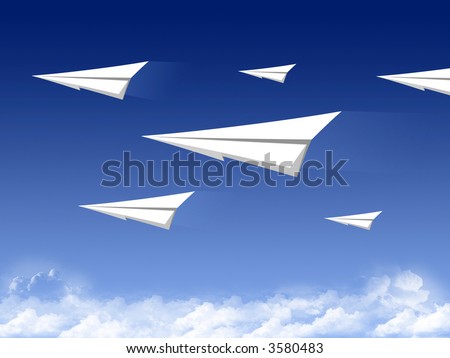 Paper plane fleet flying on a background of the blue sky with beautiful clouds