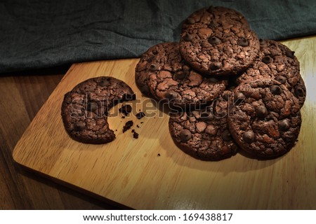 Soft Chocolate Fudge Cookie on wooden cutting board and blue linen napkin