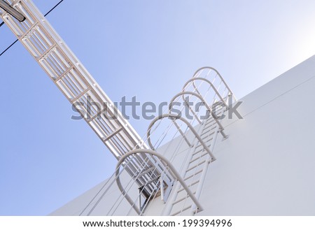 safety ladder for roof maintenance or fire emergency escape ladder on a building in vertical angle