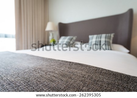 Bed and pillow set with bed runner. soft focus on bed runner. intended blur