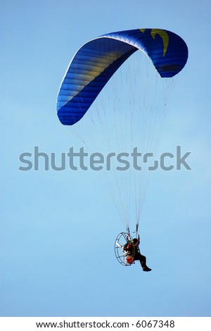 Man on an blue parachute