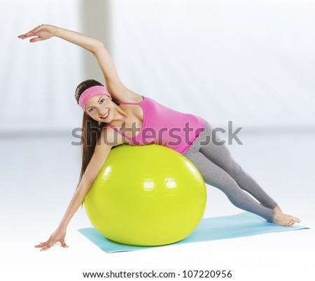 attractive fit woman pilates exercise isolated