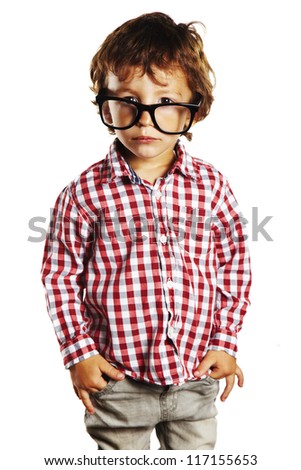 Child with rimmed glasses and hands in pockets. Portrait of child with plaid shirt isolated on white