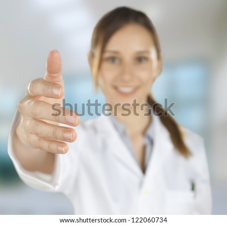 Medical people. Young doctor woman giving hand