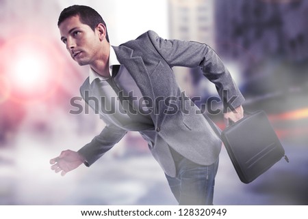 Handsome businessman with briefcase. / Young businessman walking on the city