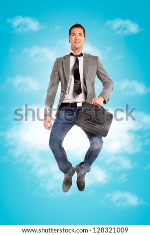Handsome businessman on the clouds / Young businessman jumping with briefcase