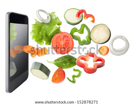 Tablet and vegetables isolated. Recipes application concept. Vegetables and tablet, isolated. Recipes application concept.