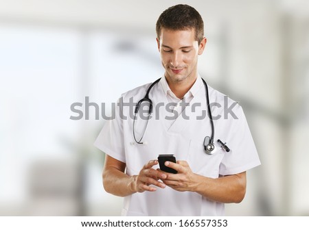 Portrait of smiling medical doctor./  Doctor man with stethoscope sending a message in the hospital.