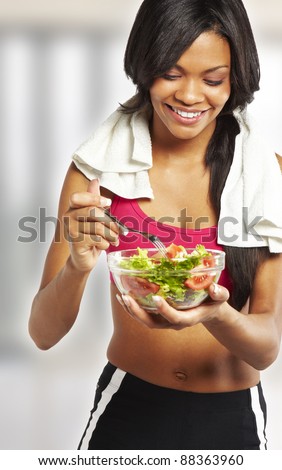 sport woman eating salad