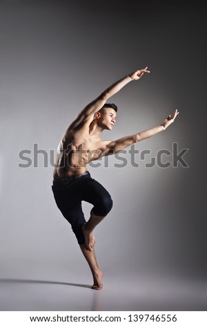 Young And Stylish Modern Ballet Dancer On Grey Background