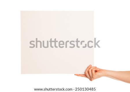 in hand a big blank sheet of white paper shown up.  Hand holds edge. Isolated, over white background.