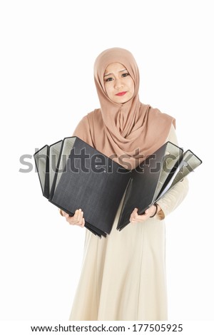 thoughtful Muslim business woman with empty files.