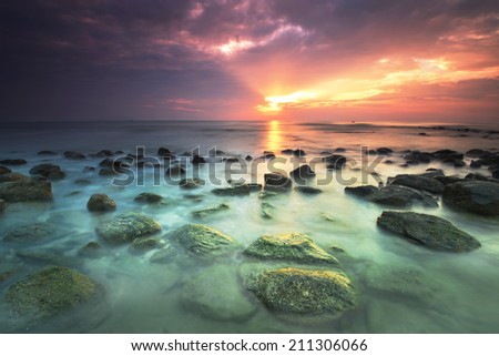 Sunrise and Ancient Rocks with moss