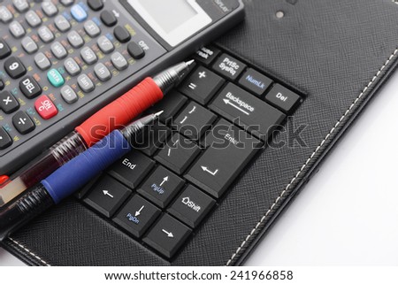 Business concept with pen ,keyboard and calculator, stock photo.