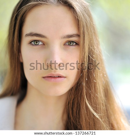 Beautiful girl face. Outdoor - close up