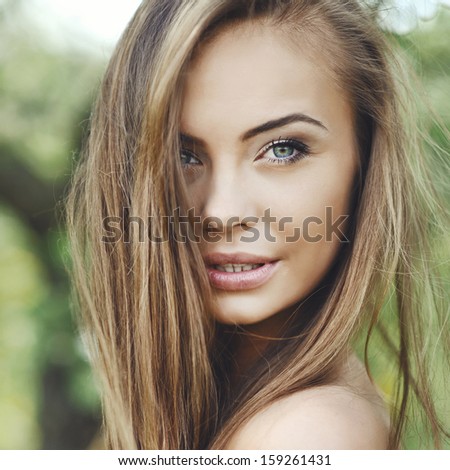 Close up of a beautiful girl face - outdoor portrait
