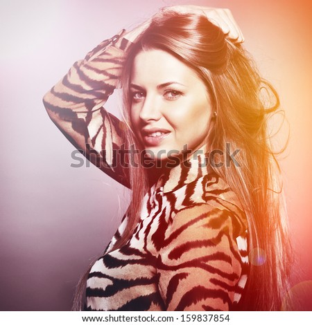 Beautiful sensual fashion woman. Multicolored pop art photo toned in warm colors