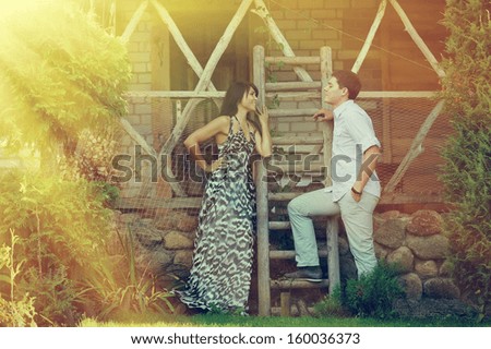 Outdoor portrait of young sensual couple in summer