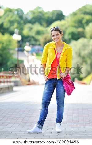 Young beautiful girl at the street in casual clothes