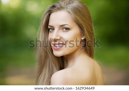 Portrait of beautiful young girl with clean skin on pretty face