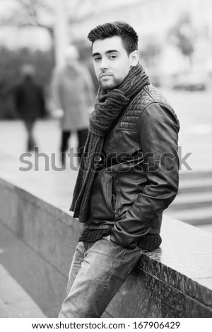 Portrait of handsome young man in the city. Black & white