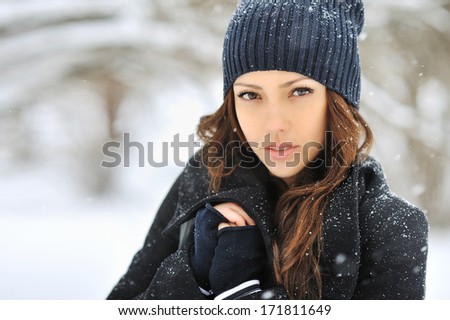 Beautiful woman face in winter - close up
