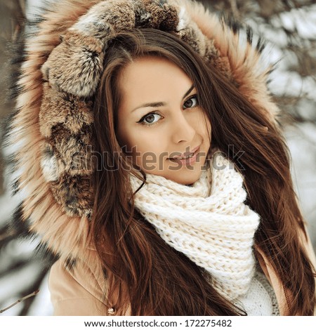 Beautiful girl face in winter - close up
