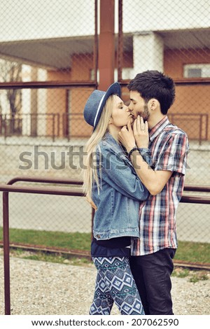Young couple in love outdoor, retro filter