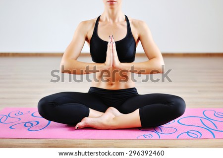 Young beautiful woman in the prayer position - closeup