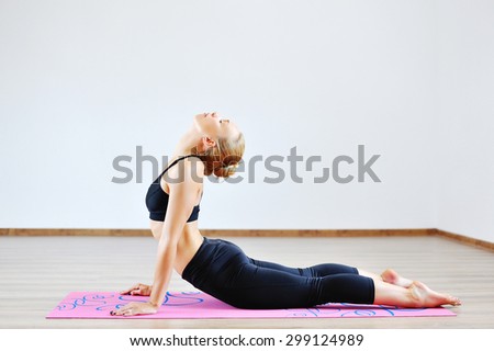 Woman in the cobra yoga pose