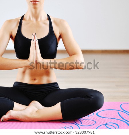 Young beautiful woman in prayer position - closeup