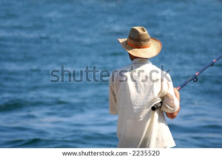 image of a fisherman wearing straw hat