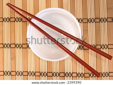 dish and chop sticks places on a straw matte