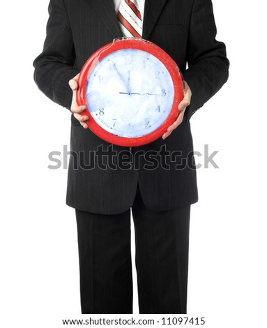 businessman holding a frozen clock in hand