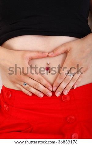 close up shot of a young woman with piercing on her belly button