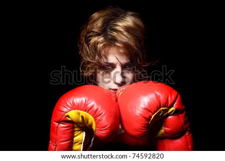 young woman wearing boxing gloves